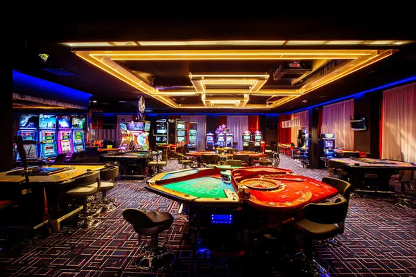 SUPERJILI Mobile Casino — Play anytime, anywhere A player using their smartphone during a festive local event, representing SUPERJILI’s fully mobile-friendly casino.